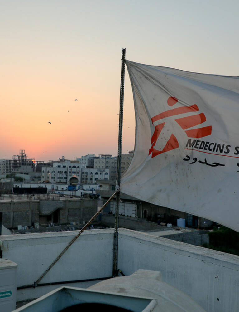 MSF flag over the top of the hospital